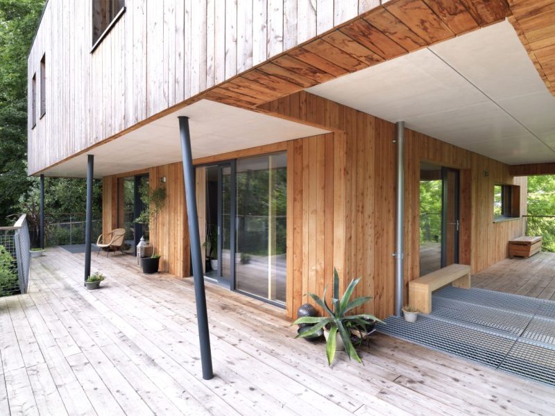 Passivhaus project - treehouse with wooden panelling and decking with mesh flooring