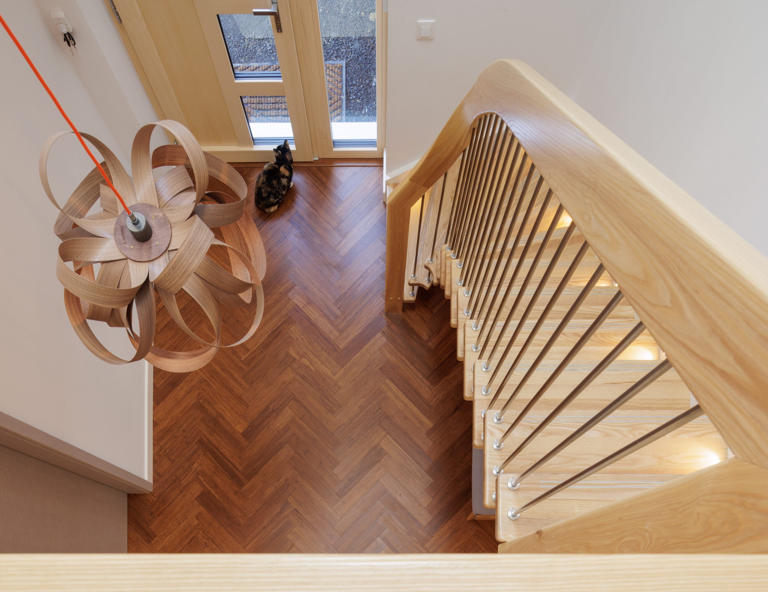 A downward angle of a staircase that curves towards the bottom.