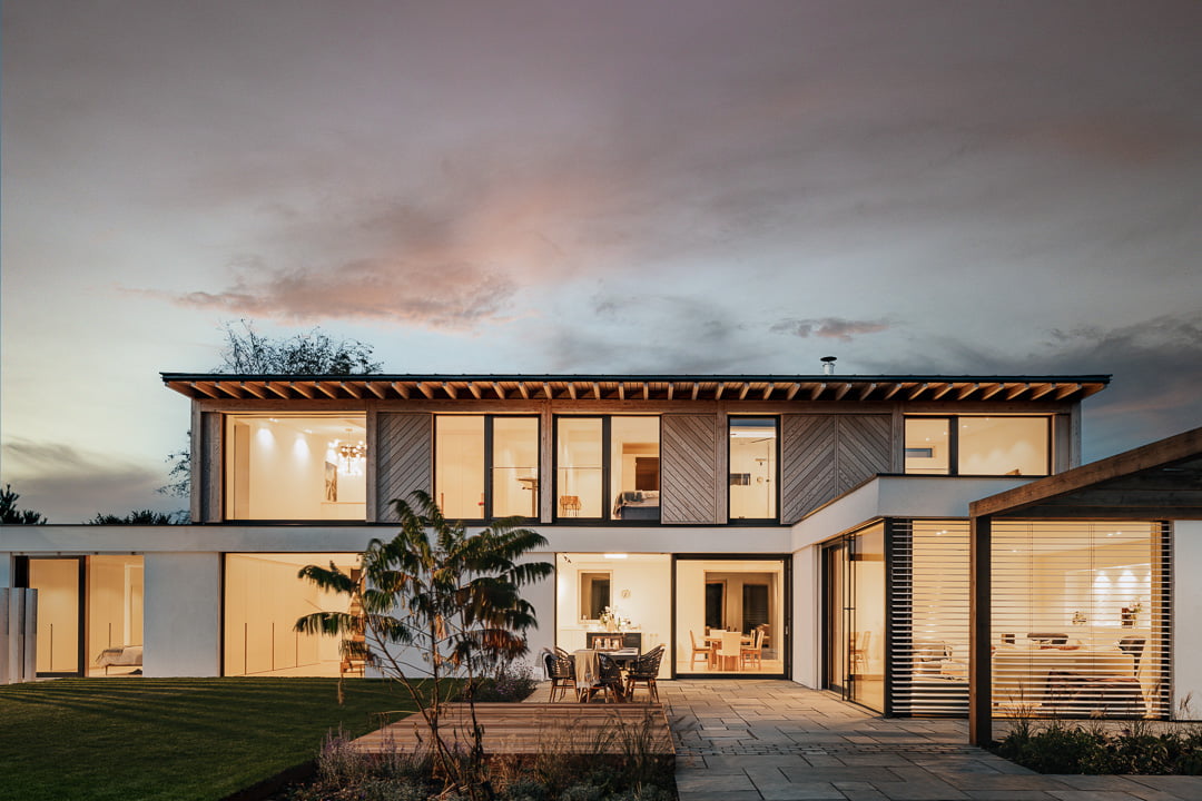 Abbey court architecture project - front view of house at dusk